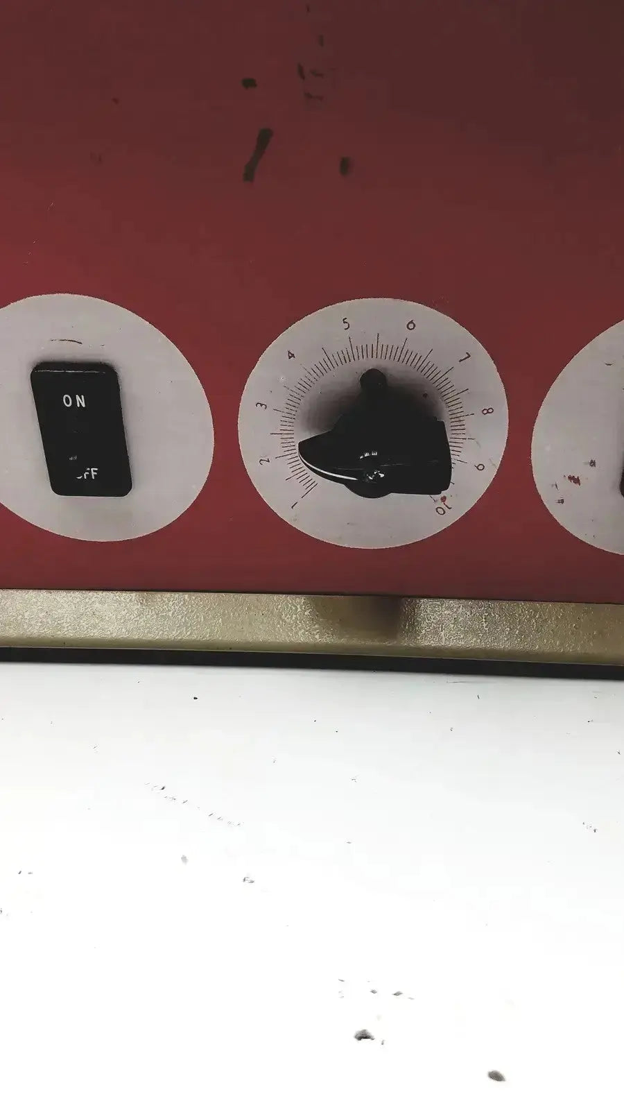 Red industrial control panel with black toggle switch and dial on napco national appliance water bath model 220