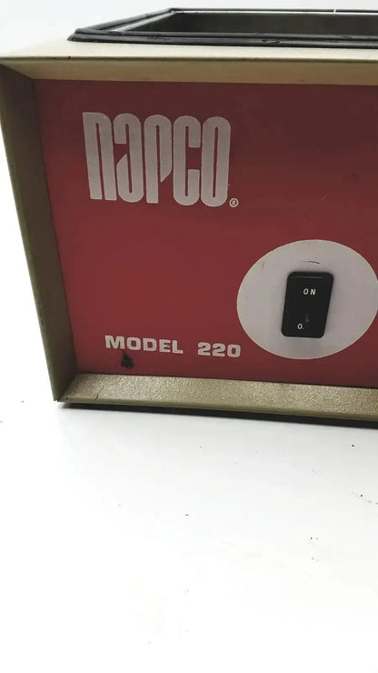 Red and beige Napco National Appliance Company model 220 water bath with electronic heating unit and black toggle switch