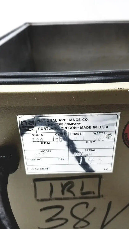 Beige metal water bath appliance from napco national appliance company with white label and black text markings