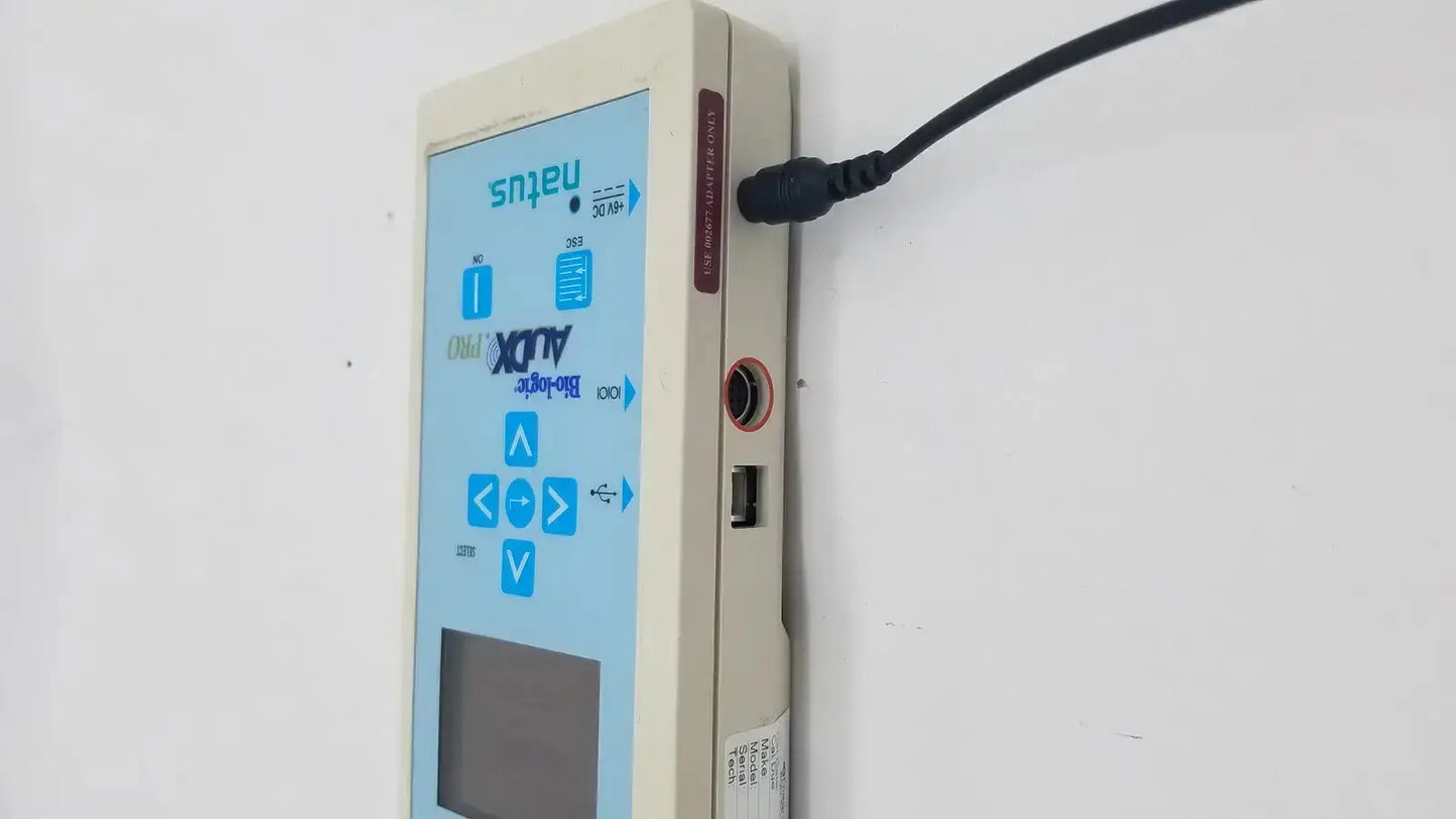 Beige rectangular medical device with blue touchscreen and buttons branded natus bio-logic audx pro auDX Pro 580-AXPBOX-026