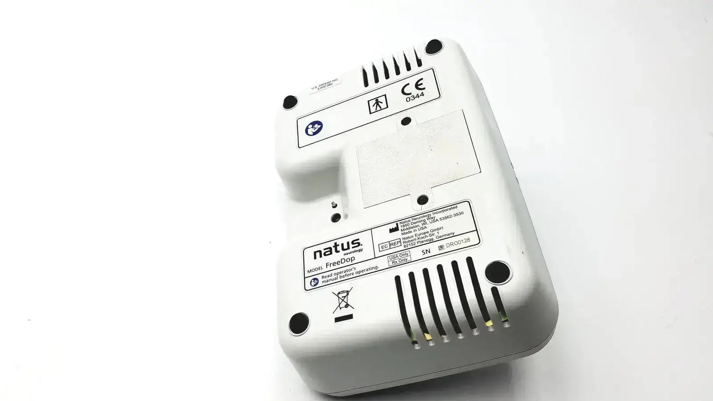 White plastic neurology freedop dr00128 device back with ventilation slits and regulatory labels for natus neurology freedop g-bbac5-1f