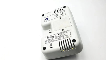 White plastic neurology freedop dr00128 device back with ventilation slits and regulatory labels for natus neurology freedop g-bbac5-1f