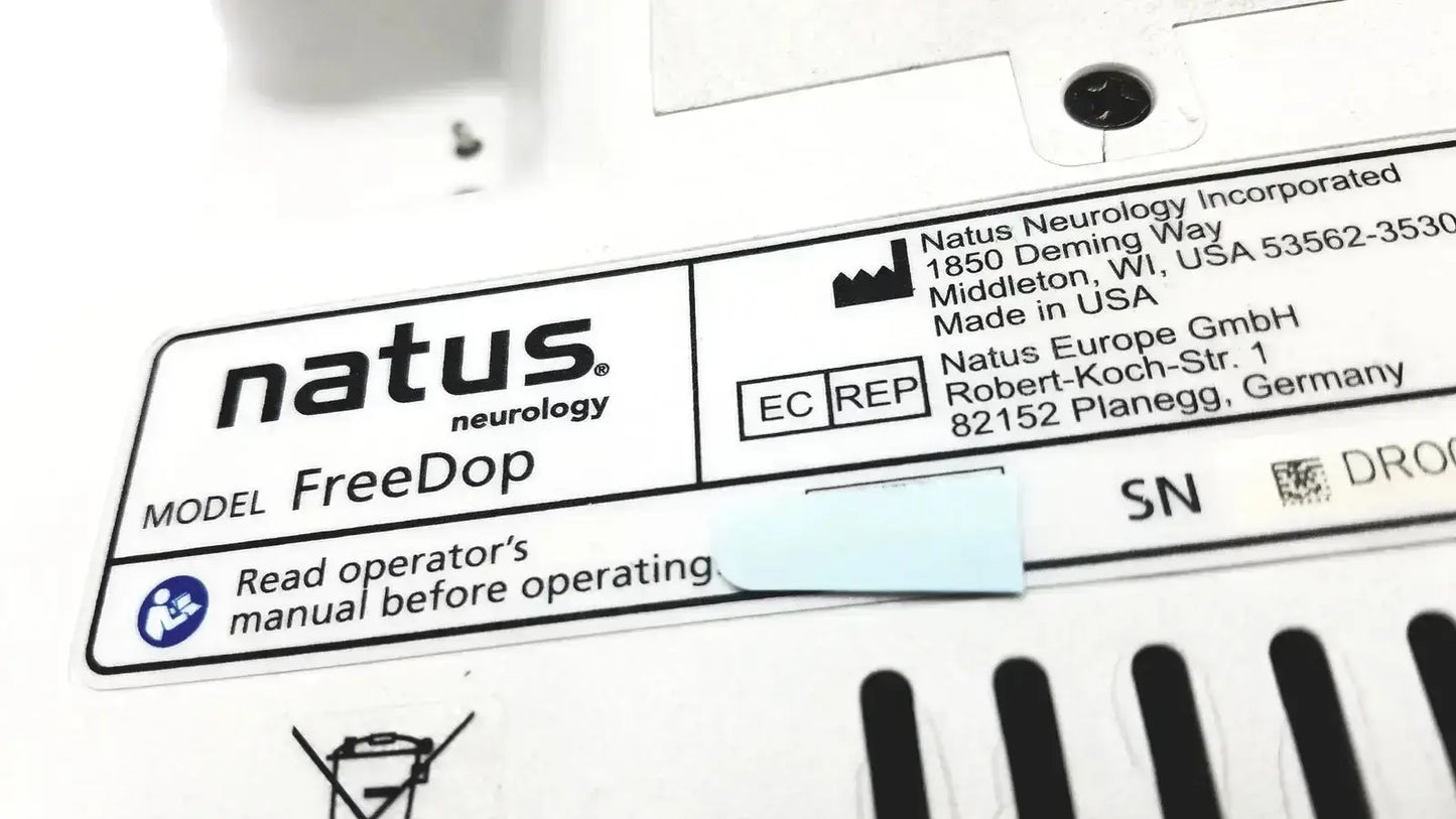 White rectangular label with black text and logo for natus neurology freedop neurology freedop dr00128 with manufacturer details and operator manual warning