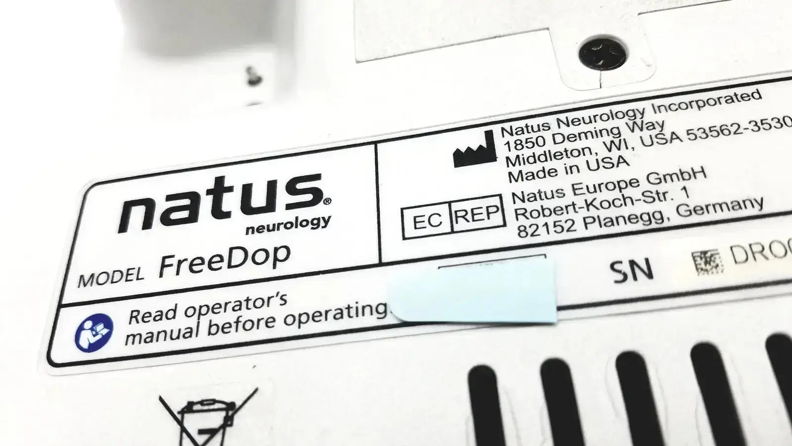 White rectangular label with black text and logo for natus neurology freedop neurology freedop dr00128 with manufacturer details and operator manual warning