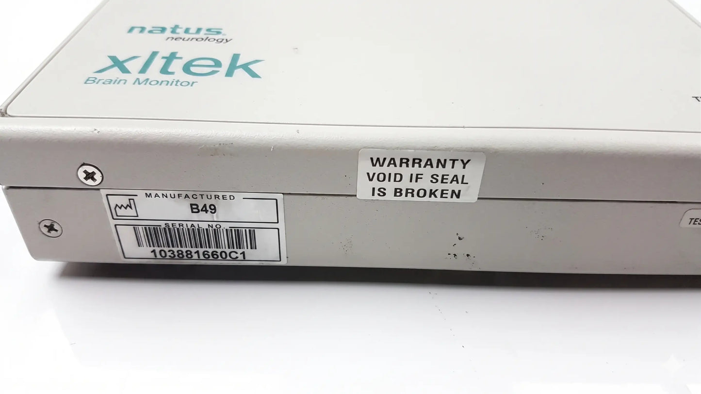 White rectangular brain monitor with natus neurology xltek branding and warranty sticker for reuse medical equipment