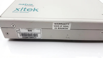 White rectangular brain monitor with natus neurology xltek branding and warranty sticker for reuse medical equipment