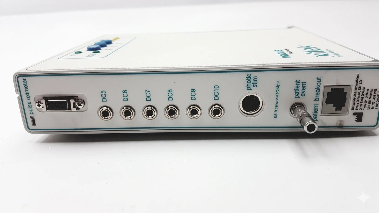 White rectangular brain monitor with multiple ports and a blue button by natus neurology xltek for reuse medical equipment