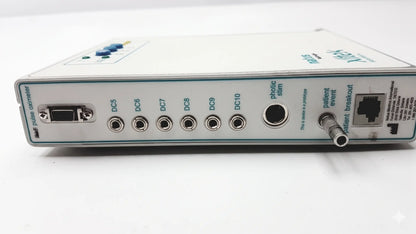White rectangular brain monitor with multiple ports and a blue button by natus neurology xltek for reuse medical equipment
