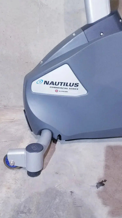 Gray nautilus commercial series schwinn blue indoor cycling bike with sleek metallic frame and modern design