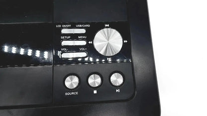 Black naxa 10 inch portable dvd player with silver control knobs and central volume dial for easy setup and source selection
