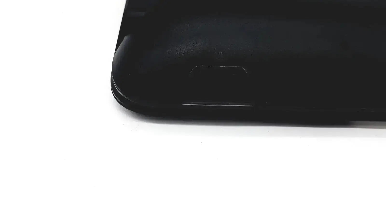 Black glossy smartphone with rounded edges shown with naxa 10 inch portable dvd player model no npd-1003 for portable dvd use