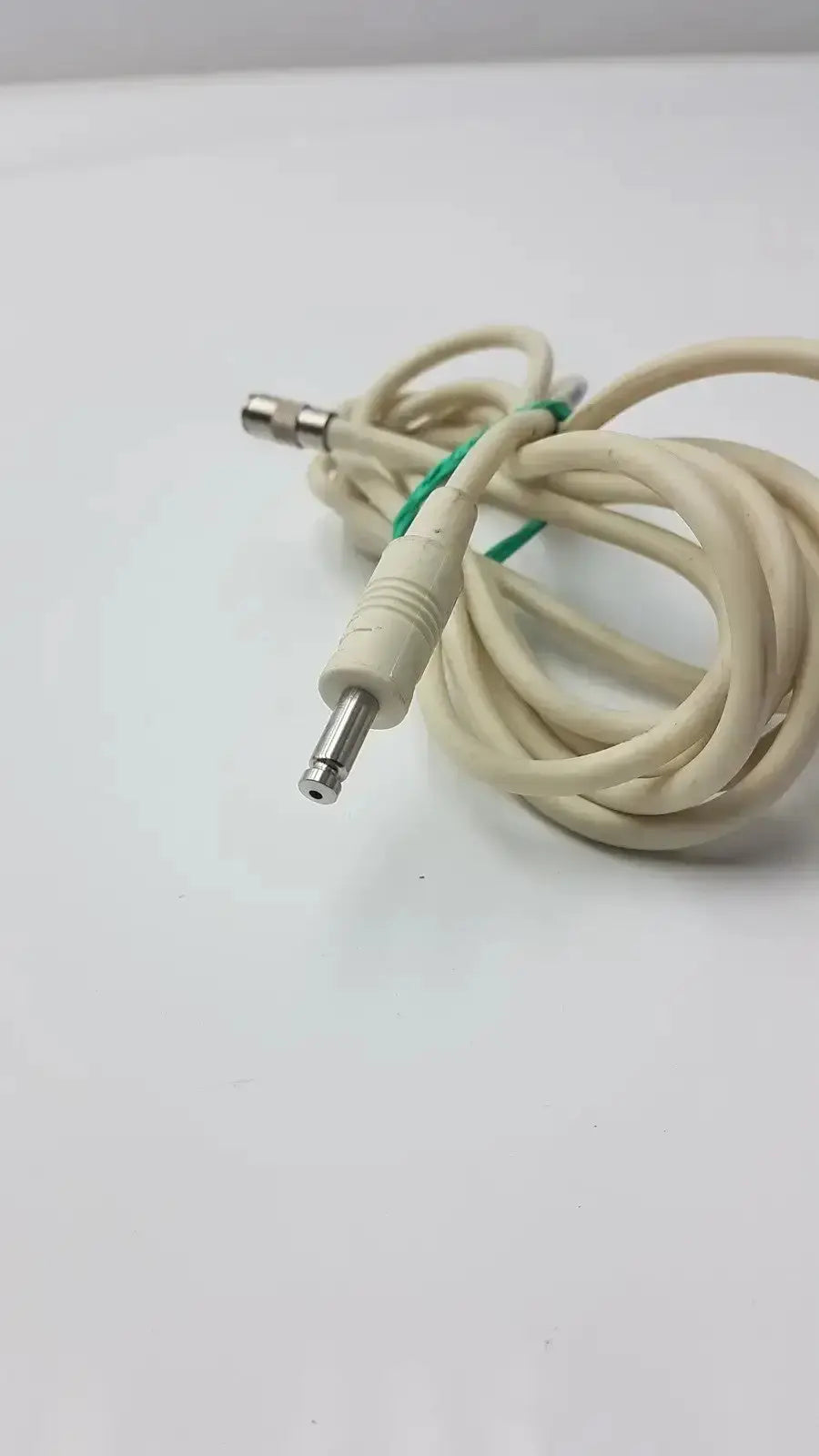 Beige nbp sensor probe cable with green tie and metallic straight plug connectors for precise sensor connectivity