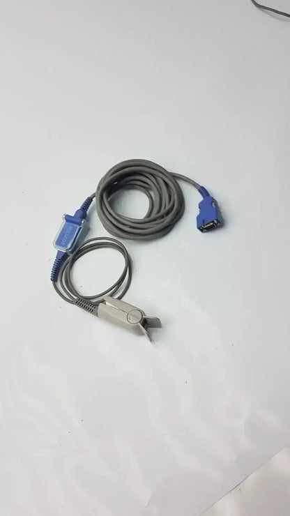 Gray coiled extension cable with blue connectors and silver pulse oximeter finger clip for used medical equipment sale