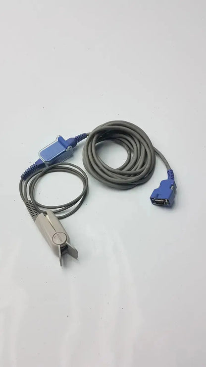 Gray coiled extension cable with blue connectors and silver pulse oximeter finger clip used medical equipment for sale
