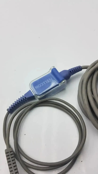 Blue and clear plastic finger clip extension cable with gray coiled cord used medical equipment for sale