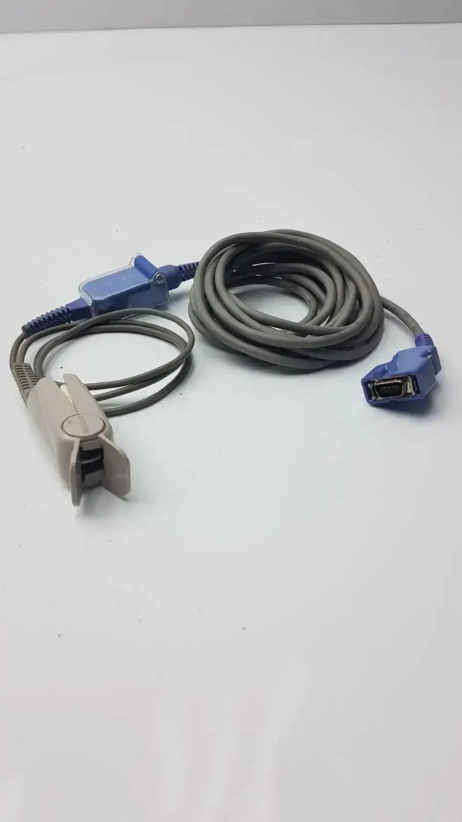 Gray and blue Nellcor finger clip senso adapt extension cable with clip sensor and connector plug used medical equipment for sale
