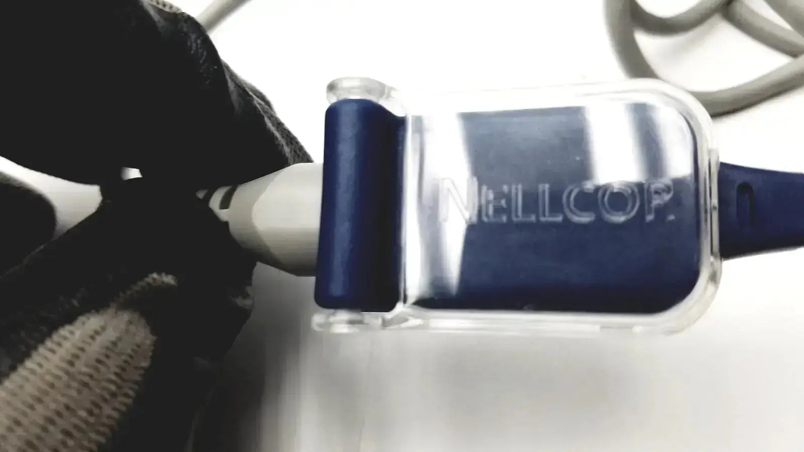 Clear plastic spo2 adapter cable with blue rubberized grip and nellcoop branding for use with nellcor oxygen sensor