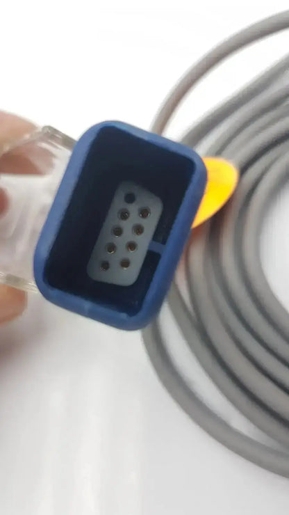 Blue plastic connector with gray socket and coiled cable in nellcor pulse oximetry interface cable doc-10