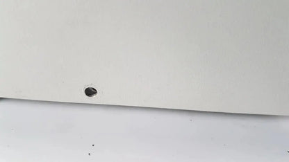 White flat panel with small circular hole near bottom edge on netzsch gmbh sta 409 pc luxx simultaneous thermal analyzer
