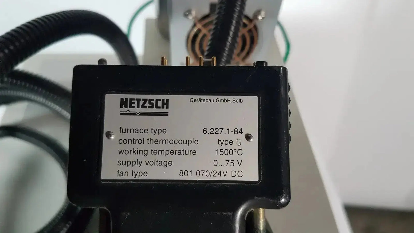 Black rectangular control panel with white label showing technical specifications for netzsch gmbh sta 409 pc luxx simultaneous thermal analyzer