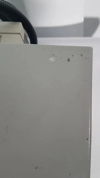 Gray rectangular metal panel with minor scratches on the back side of netzsch gmbh sta 409 pc luxx simultaneous thermal analyzer