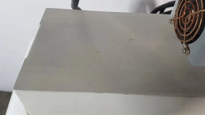 Gray metallic Netzsch GmbH STA 409 PC Luxx simultaneous thermal analyzer with copper-colored fan assembly on top right corner