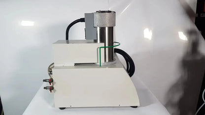 Industrial-grade white and metallic gray hydraulic press with black hoses and red fittings for Netzsch simultaneous thermal analyzer