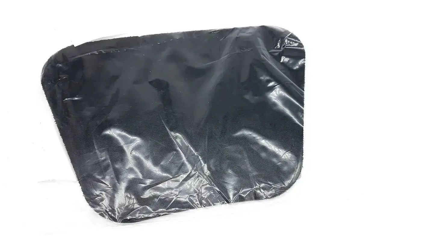 Black plastic trash bag with crinkled surface and rounded corners shown as moldable lumbar insert packaging back side