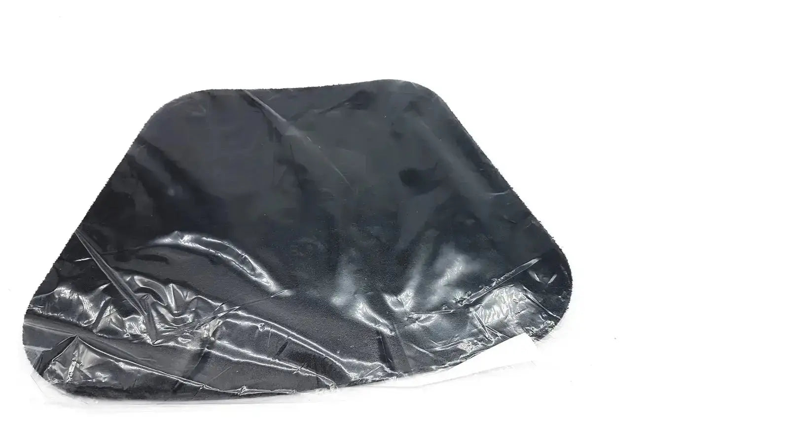 Black glossy plastic bag with crinkled texture and irregular edges containing moldable lumbar insert new option sports