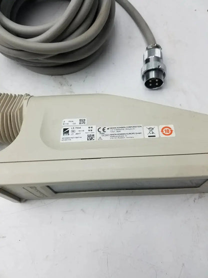 Beige plastic nihon kohden ls-703a photic stimulator sensor with coiled gray cable and metallic connector