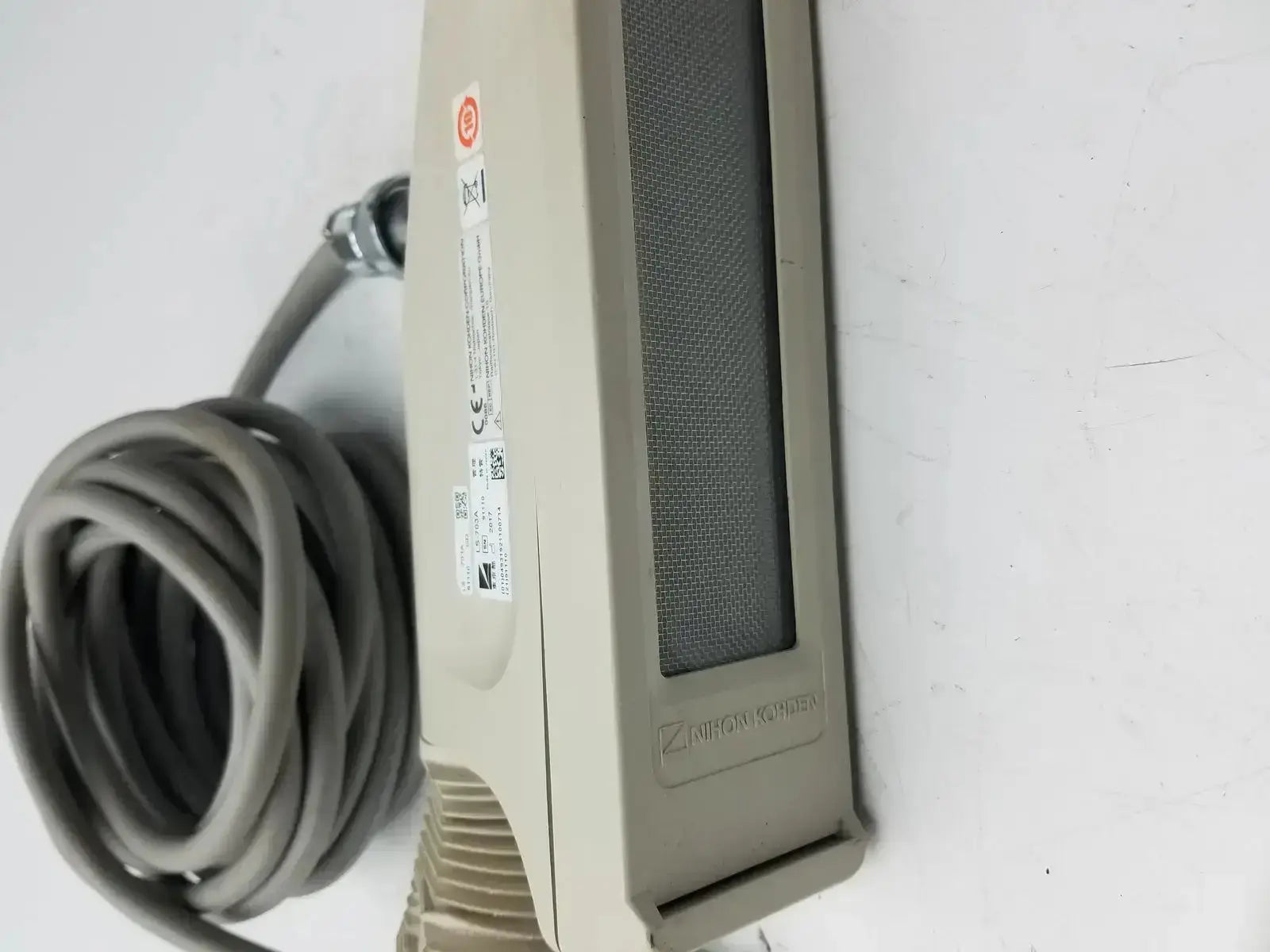 Beige nihon kohden ls-703a photic stimulator sensor with gray mesh panel and coiled cable for precise monitoring