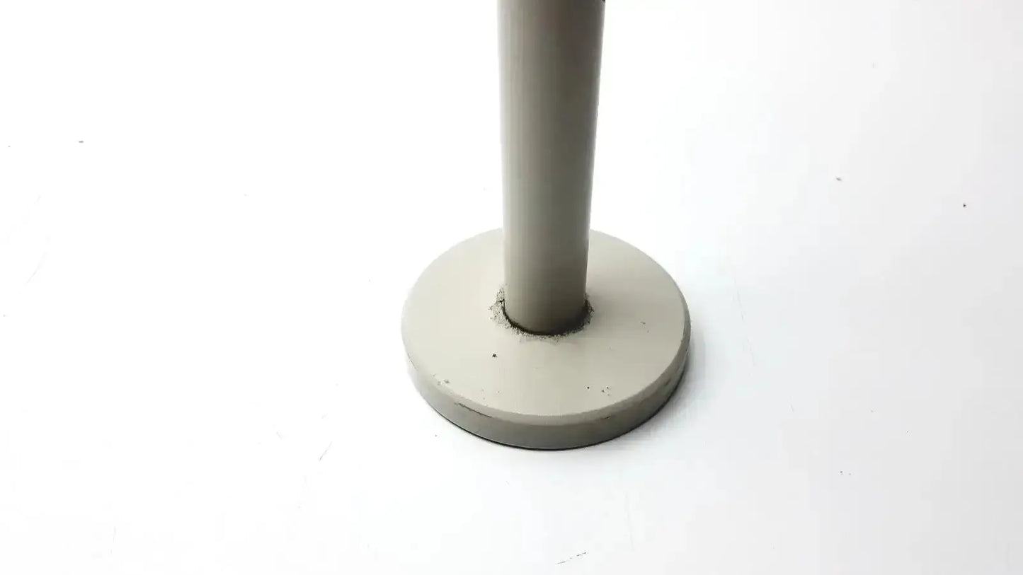 Gray cylindrical stand with flat circular base for Nikon 030039 binocular microscope, ideal to buy used medical equipment