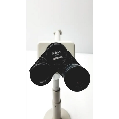 Black nikon binoculars with a matte finish and engraved branding.