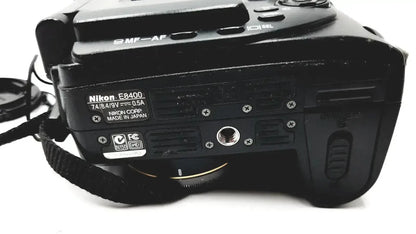 Black nikon coolpix e8400 digital camera body with matte finish showing model and specifications on the back side for reliable monitoring