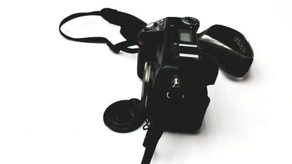 Black nikon coolpix e8400 digital camera with textured strap and lens cap for reliable monitoring and pressure display monitor use
