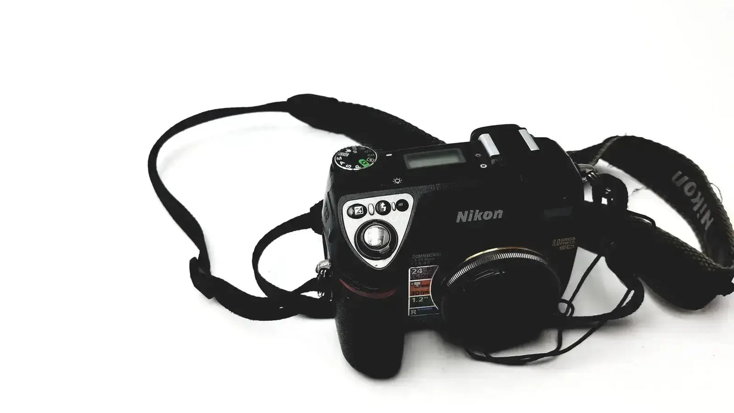 Black nikon coolpix e8400 digital camera with textured grip and silver dials for reliable monitoring and pressure display use