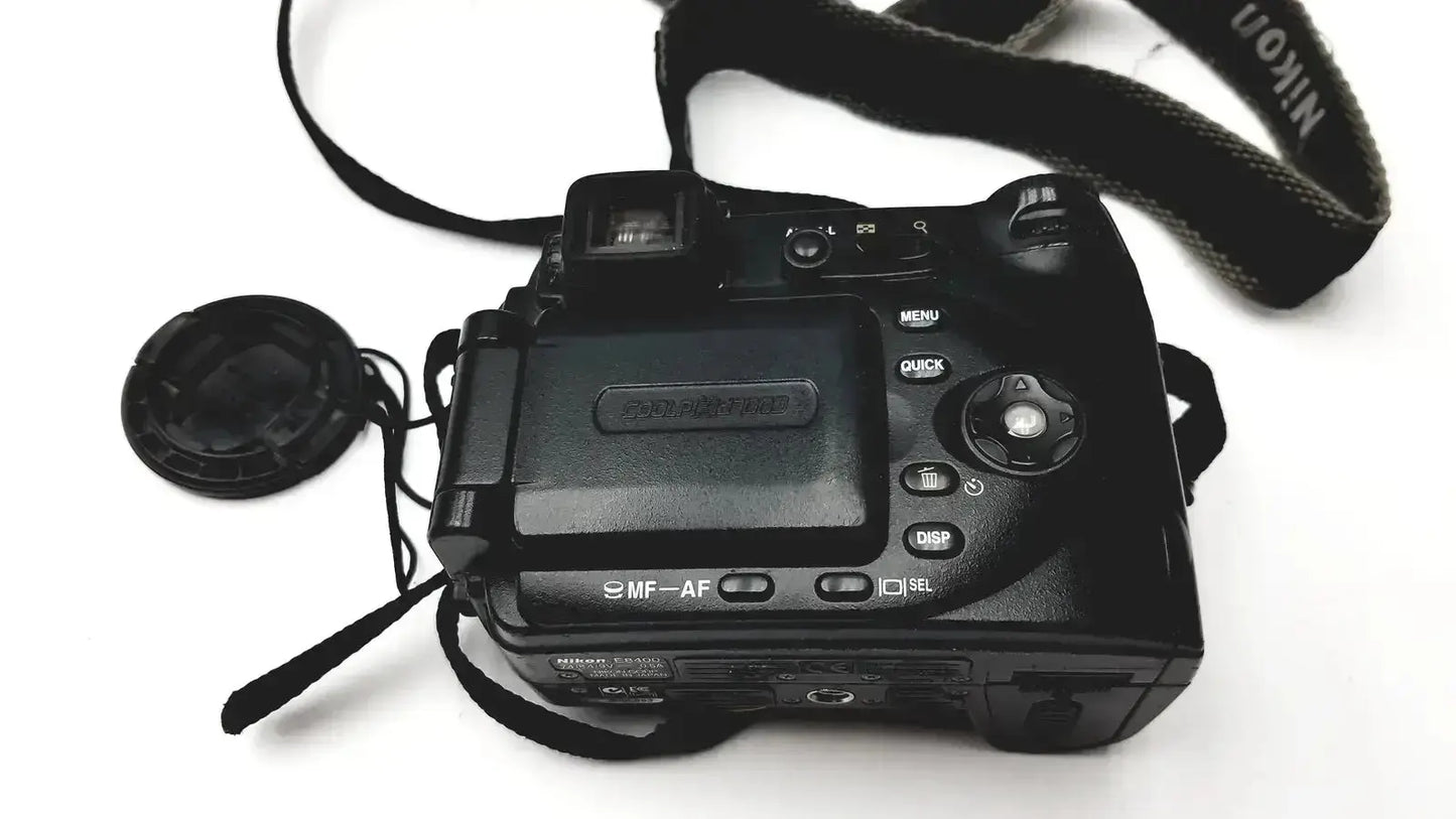 Black nikon coolpix e8400 digital camera with strap and lens cap ideal for reliable monitoring and pressure display monitor use