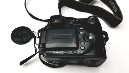 Black nikon coolpix e8400 digital camera with strap and lens cap ideal for reliable monitoring and pressure display monitor use