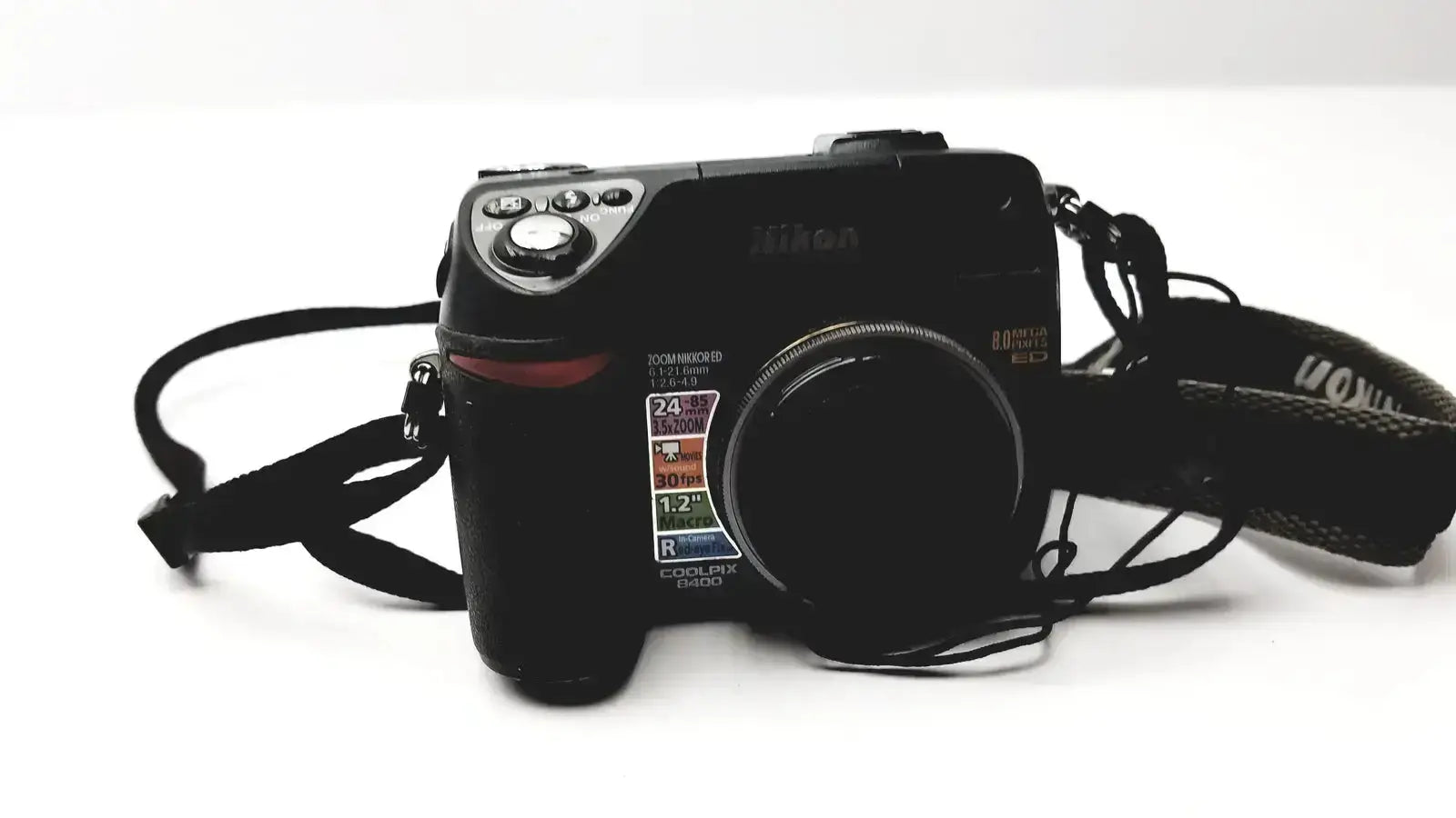 Black nikon coolpix e8400 digital camera with textured grip and visible lens specifications for reliable monitoring