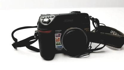 Black nikon coolpix e8400 digital camera with textured grip and visible lens specifications for reliable monitoring