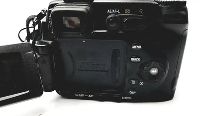 Black nikon coolpix e8400 digital camera with matte finish and visible control buttons on the back for reliable monitoring