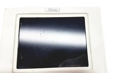 White nikon digital sight microscope camera controller with black scratched screen showing back side of the device