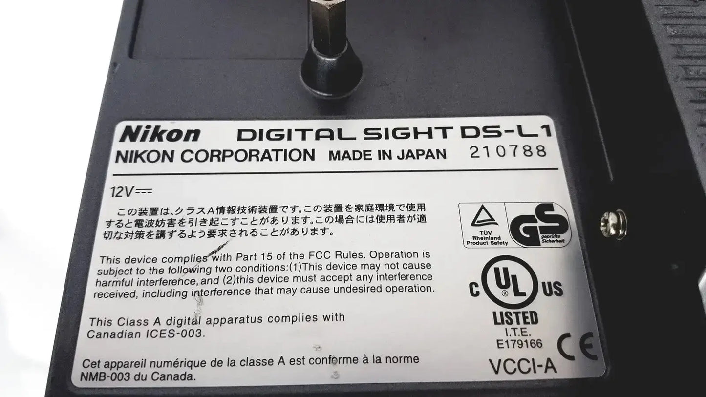 Black nikon digital sight ds-l1 microscope camera controller with matte finish and silver regulatory compliance label
