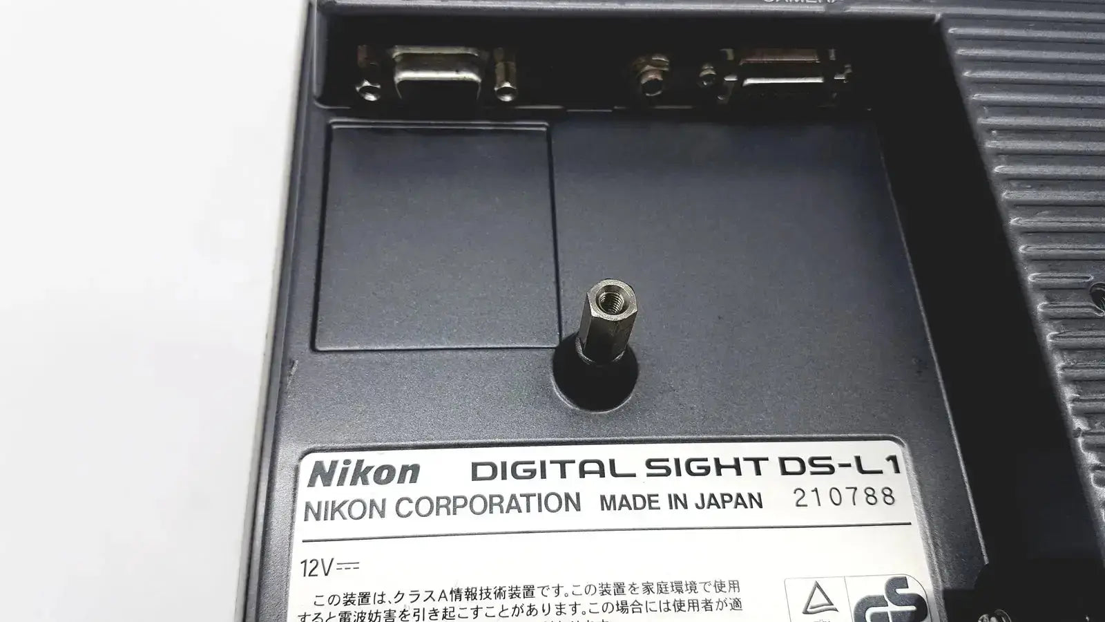 Black nikon digital sight ds-l1 microscope camera controller with matte finish and silver screw head near label