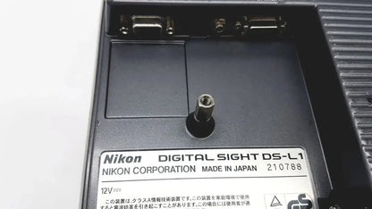 Black nikon digital sight ds-l1 microscope camera controller with matte finish and silver screw head near label