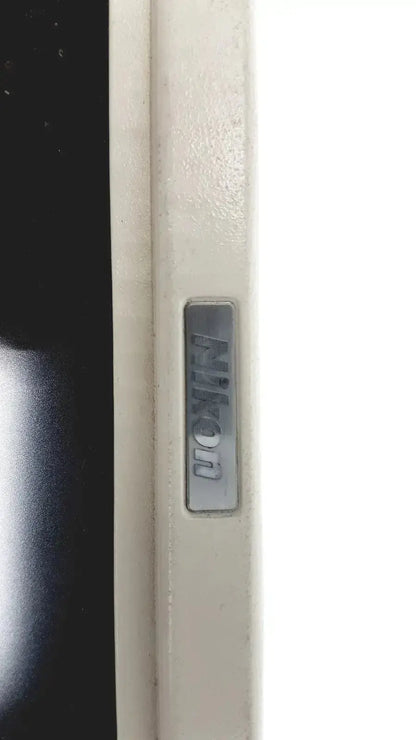 Silver rectangular nikon logo plaque on nikon digital sight ds-l1 microscope camera controller product front panel