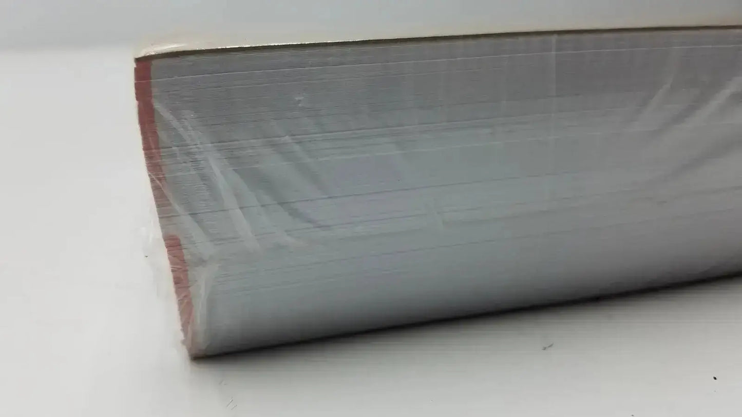 A roll of gray metallic foil with red edge wrapped in plastic for Nissha medical technologies recording charts use