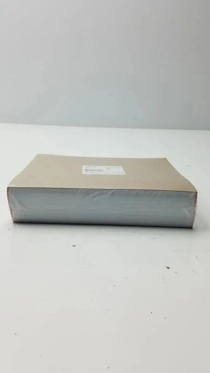 A beige cardboard box with clear plastic wrap and white label containing nissha medical technologies recording charts