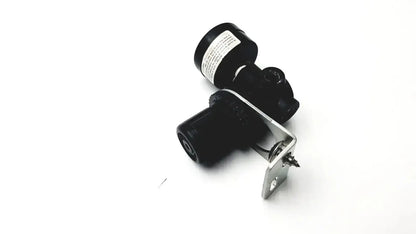 Black cylindrical camera with metallic mounting bracket shown on norgren r07-100-rgka mini pressure regulator back side