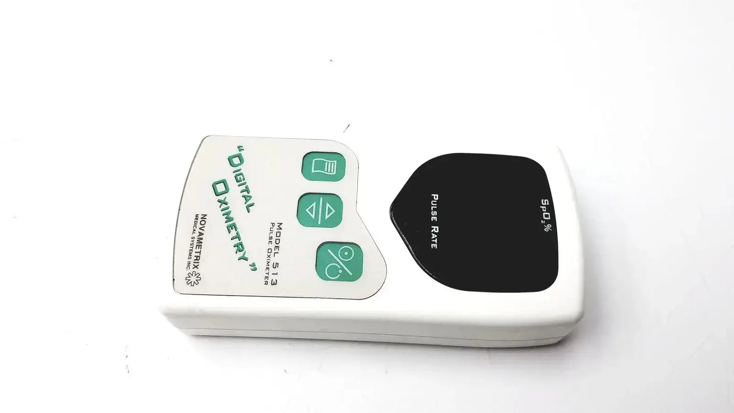 Novametrix 513 pulse oximeter monitor is a white plastic pulse oximeter with green buttons and a black display panel